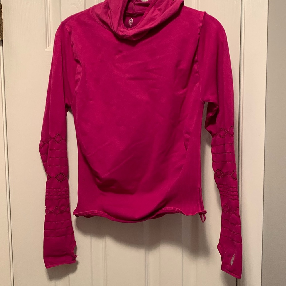 NWOT Free people movement top in a wine color with thumb holes beautiful top